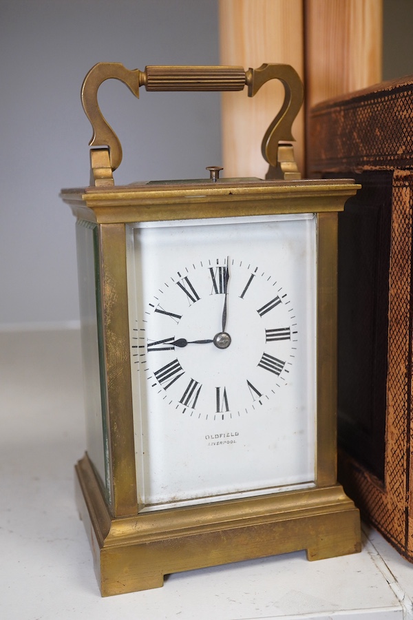 A cased repeating carriage clock, signed Oldfield, Liverpool to the face, striking on a coiled gong, with an engraved dedication to the top dated 11 February 1899. Condition - fair.